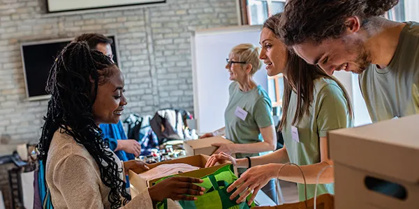 Volunteers packing boxes with supplies