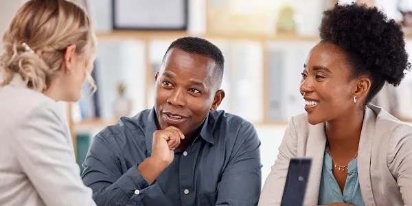 couple talking with banker